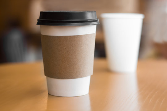 Two paper coffee cups