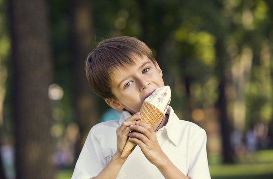 Little Boy Eating An Ice Cream