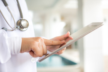 Doctor using tablet computer