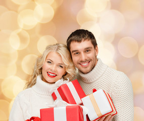 smiling man and woman with presents