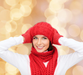Fototapeta premium smiling young woman in winter clothes
