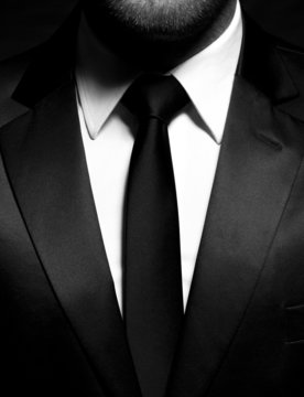 Man Gentleman In Black Suit And Tie