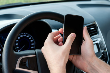 Man uses a phone in a car