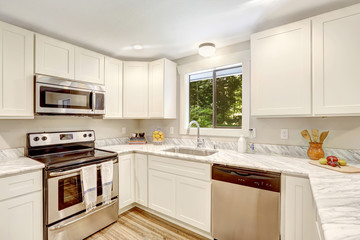Refreshing kitchen interior with white cabinets.