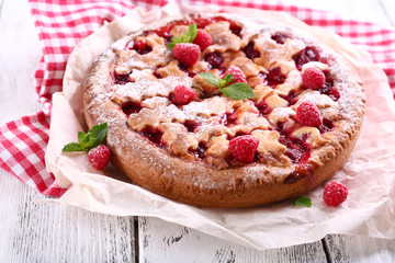 Tasty cake with berries on table close-up