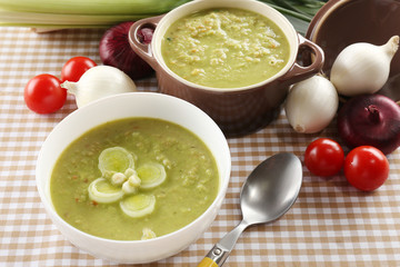 Leek soup on table, close up