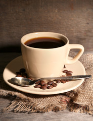 Cup of coffee on rustic wooden background