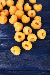 Raspberries on dark blue background