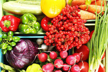 Fresh organic vegetables in wooden boxes, close up