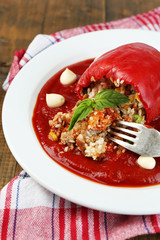 Prepared stuffed pepper with tomato sauce