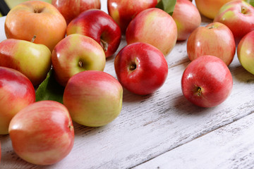 Sweet apples on wooden background