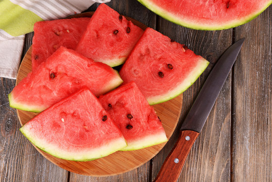 Slice of watermelon on wooden table