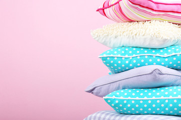 Bright pillows on pink background