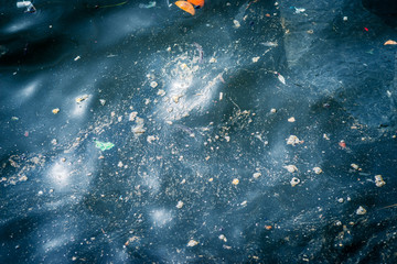 Oil and garbage pollution in the water.