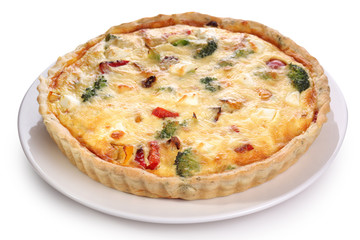 Quiche with broccoli and vegetables on a white plate.