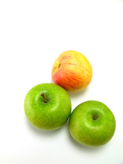 green and red apple on white