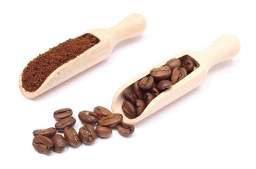Brown coffee on wooden spoon. White background