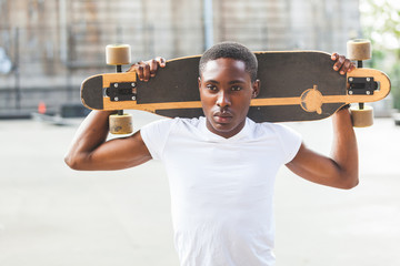 Black Boy with Longboard at Park © william87