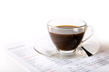 Workplace with a cup of coffee and graphs