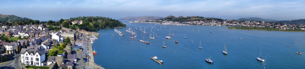 Fototapeta na wymiar Bay with sailboat and yachts in Conwy, Wales, UK