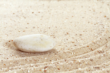 Stack of stones on sand beach