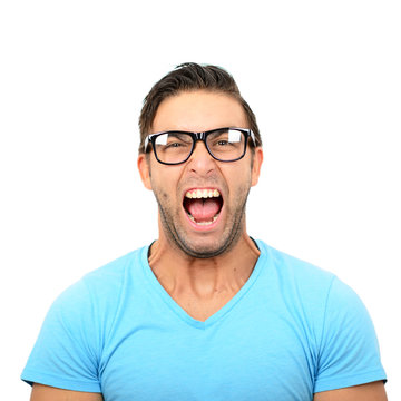 Portrait of angry man screaming against white background