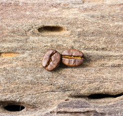 coffee grains on grunge wooden background