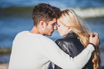 couple in love on the beach in autumn