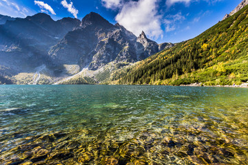 Green water mountain lake Morskie Oko, Tatra Mountains, Poland - obrazy, fototapety, plakaty