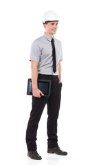 Smiling engineer holding a digital tablet.