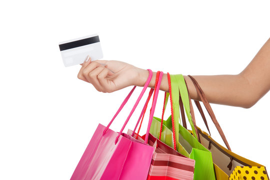 Woman with credit card and  shopping bags
