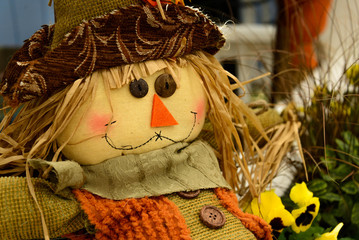 scarecrows with flowers and hay