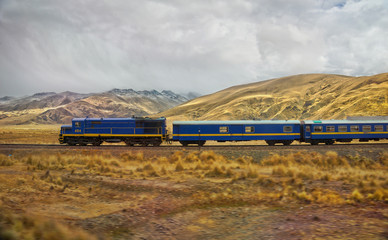 Passenger train in the entrance to  La Raya and Pukara, Puno, Pe
