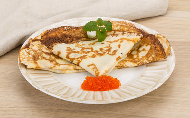 Pancakes with red caviar