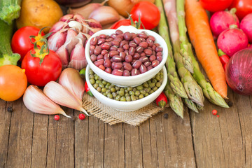 Mung and azuki beans in a bowl and vegetables