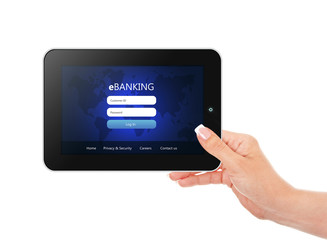 tablet with ebanking login page holded by hand  isolated over wh