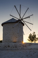 Fototapeta na wymiar Traditional old stone windmill twilight shot