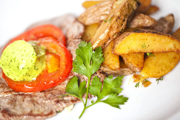 meat and potato slices with butter