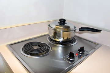Cooking on the mini electric stove top