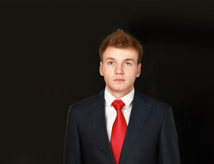 Portrait of successful business man, isolated on black