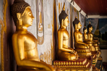 gold statues in a row
