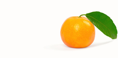 Tangerine with green leaves isolated on white