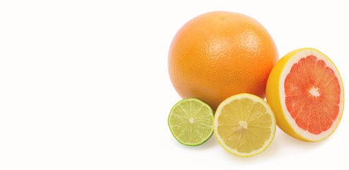 Image of a fresh whole lime, lemon and orange isolated on white