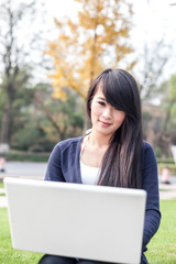 young asian woman with laptop
