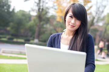 young asian woman with laptop