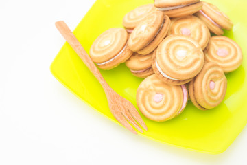 cookies on green disk with wood fork