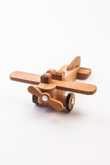 Wooden toy airplane isolated on white