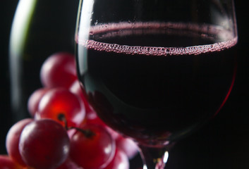 grape and glass with red wine
