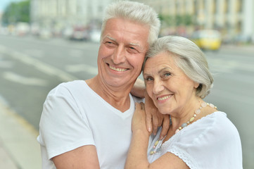 Mature couple walking in town