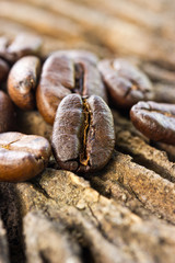 Coffee beans on wood background